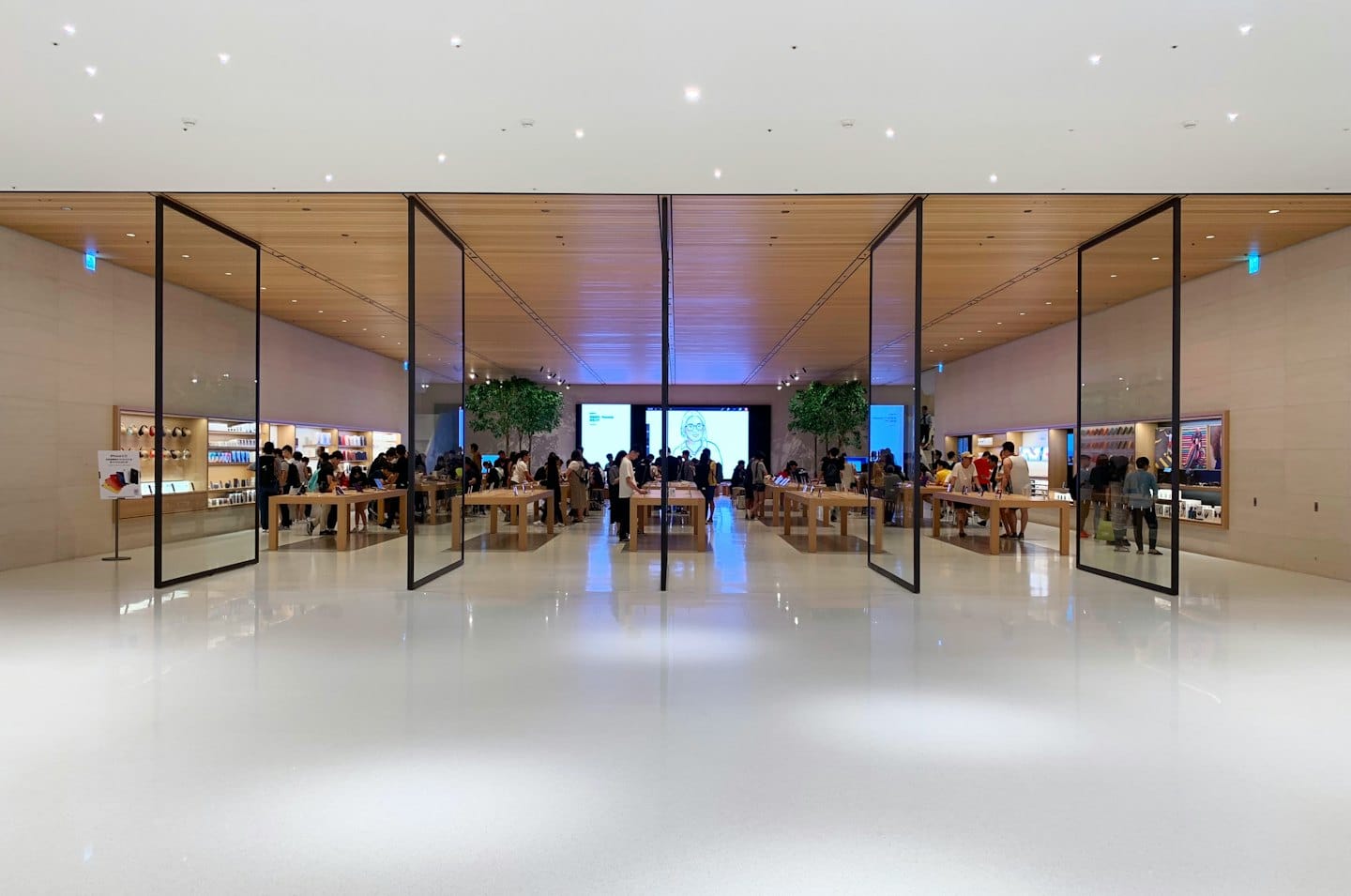 Customers browse products in a bright, modern retail store.