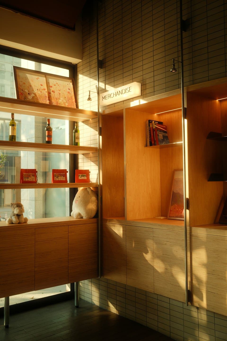 Retail shelves stocked with merchandise in a bright store.
